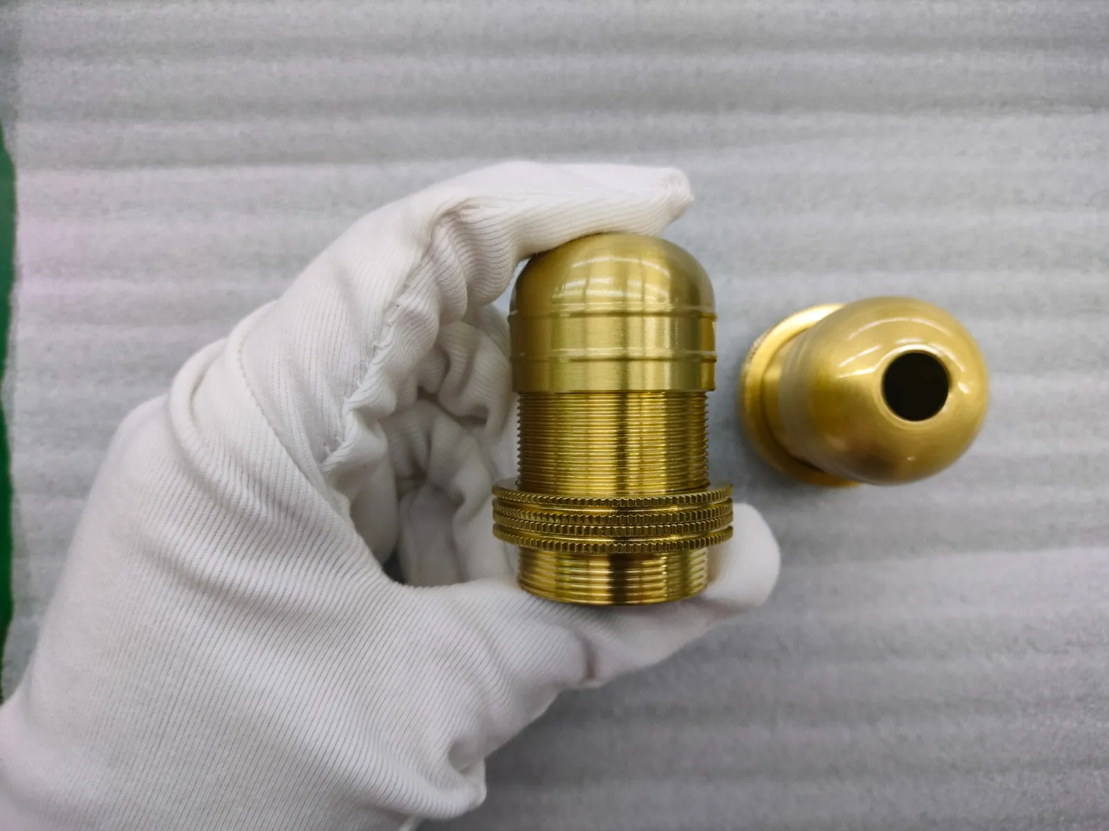 Quality inspection of lighting hardware components at the Yusheng factory